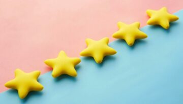 five yellow stars on blue and pink background